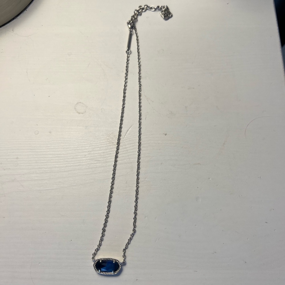 Kendra Scott necklace with navy blue pendant